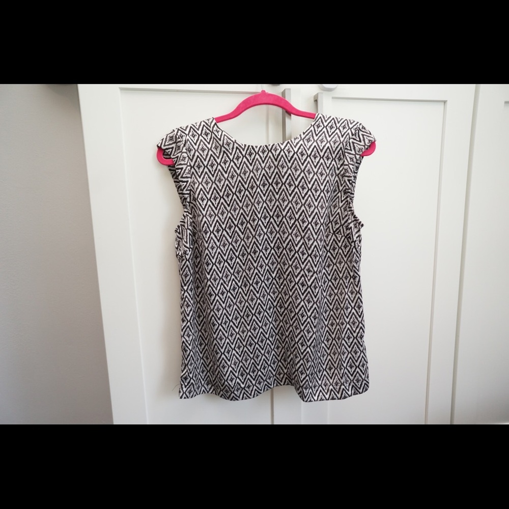 Sleeveless top with buttons down back